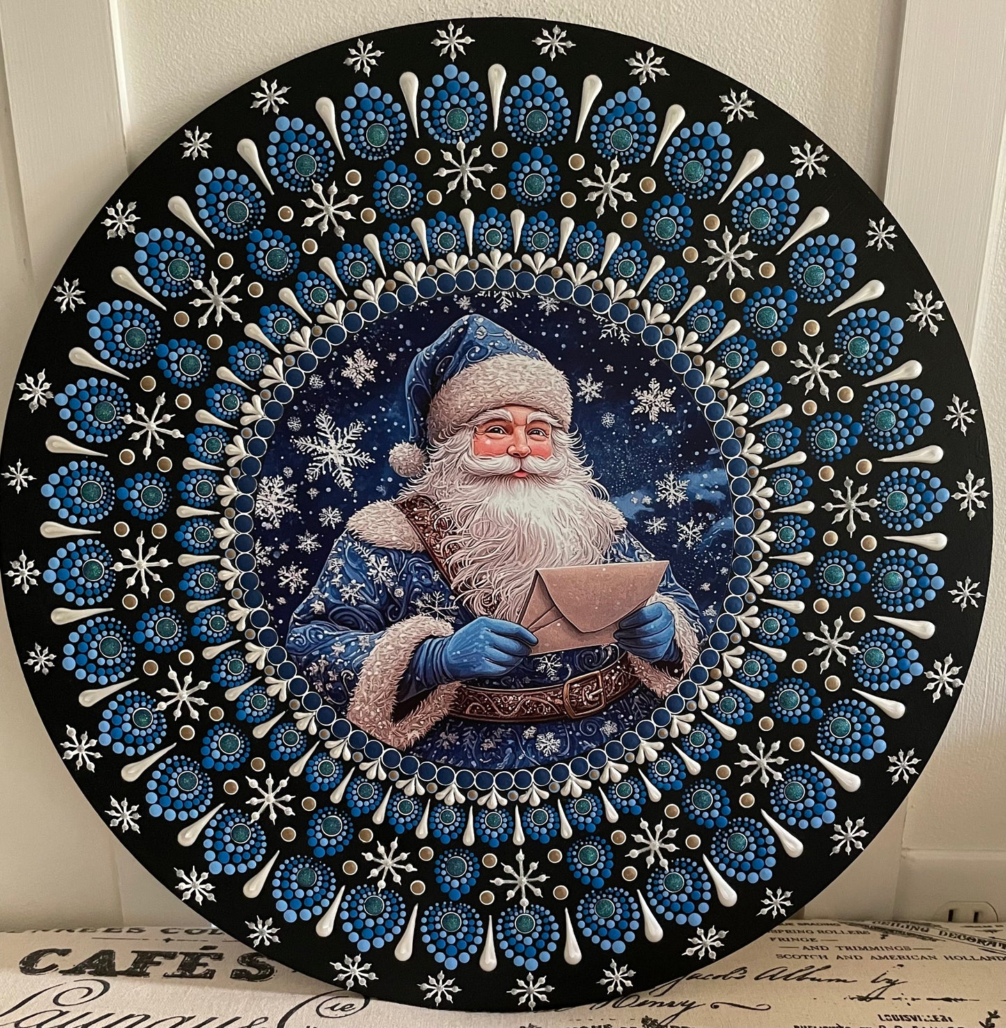 Hand painted blue Santa on a 16 inch wood round