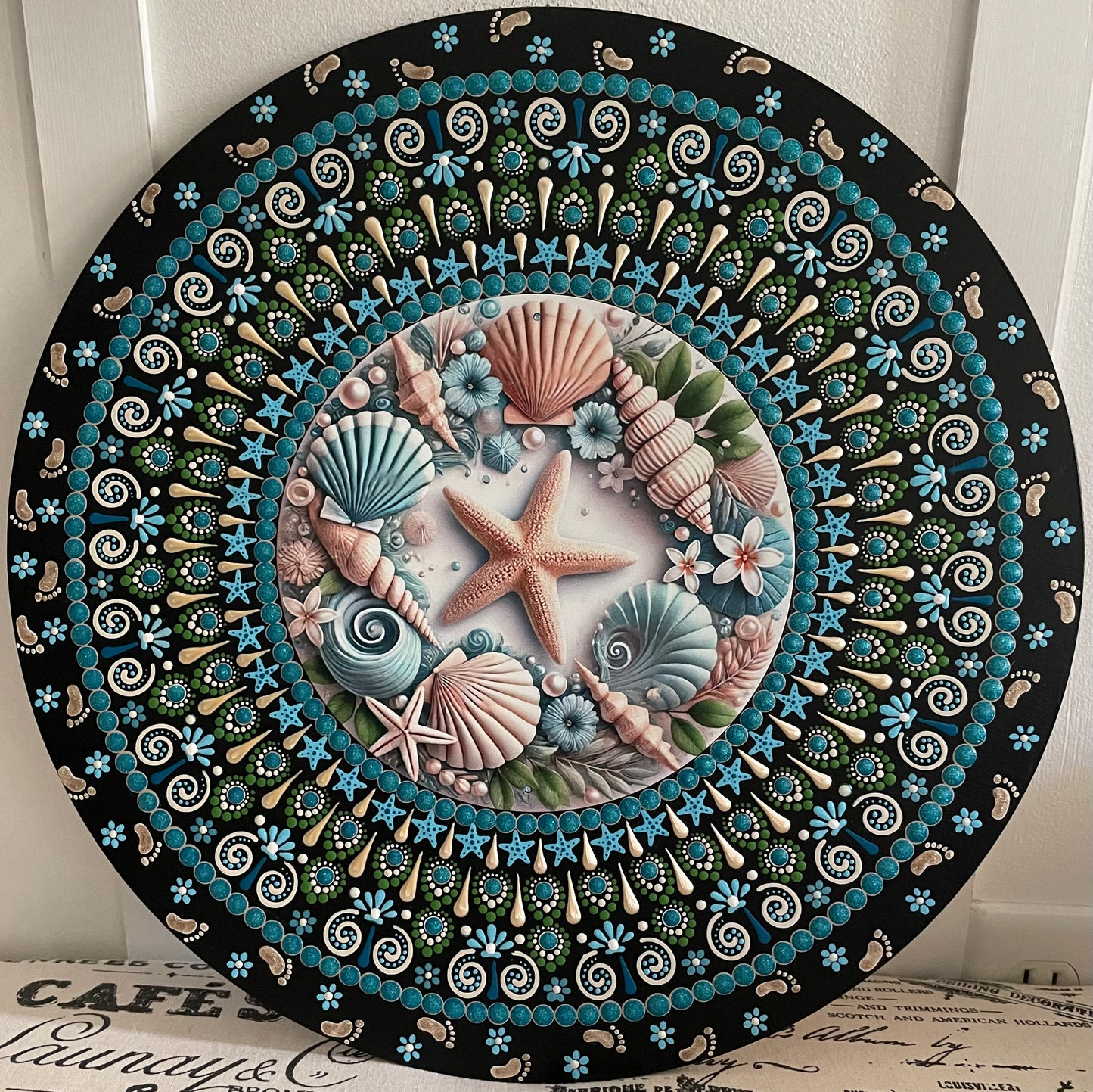 Hand painted shell plaque on a 16 inch wood round