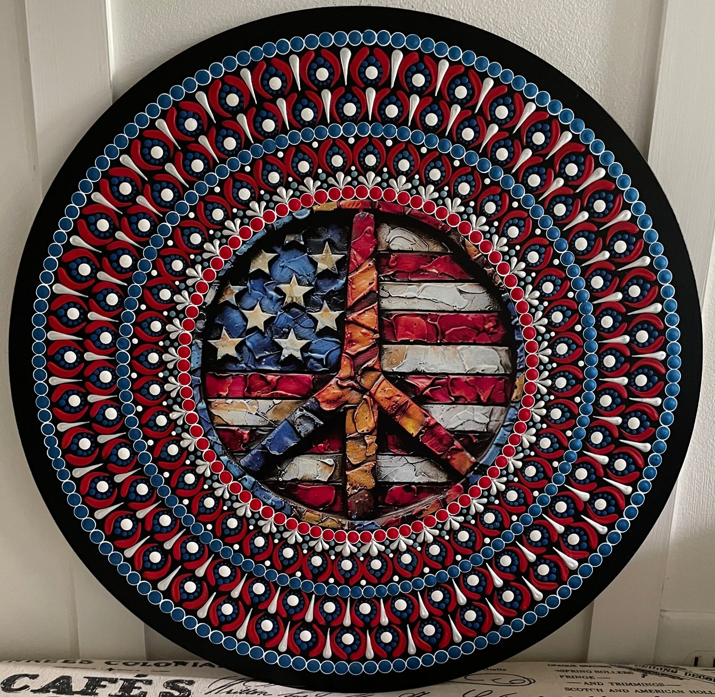 Handpainted American flag peace sign on a 16 inch wood round
