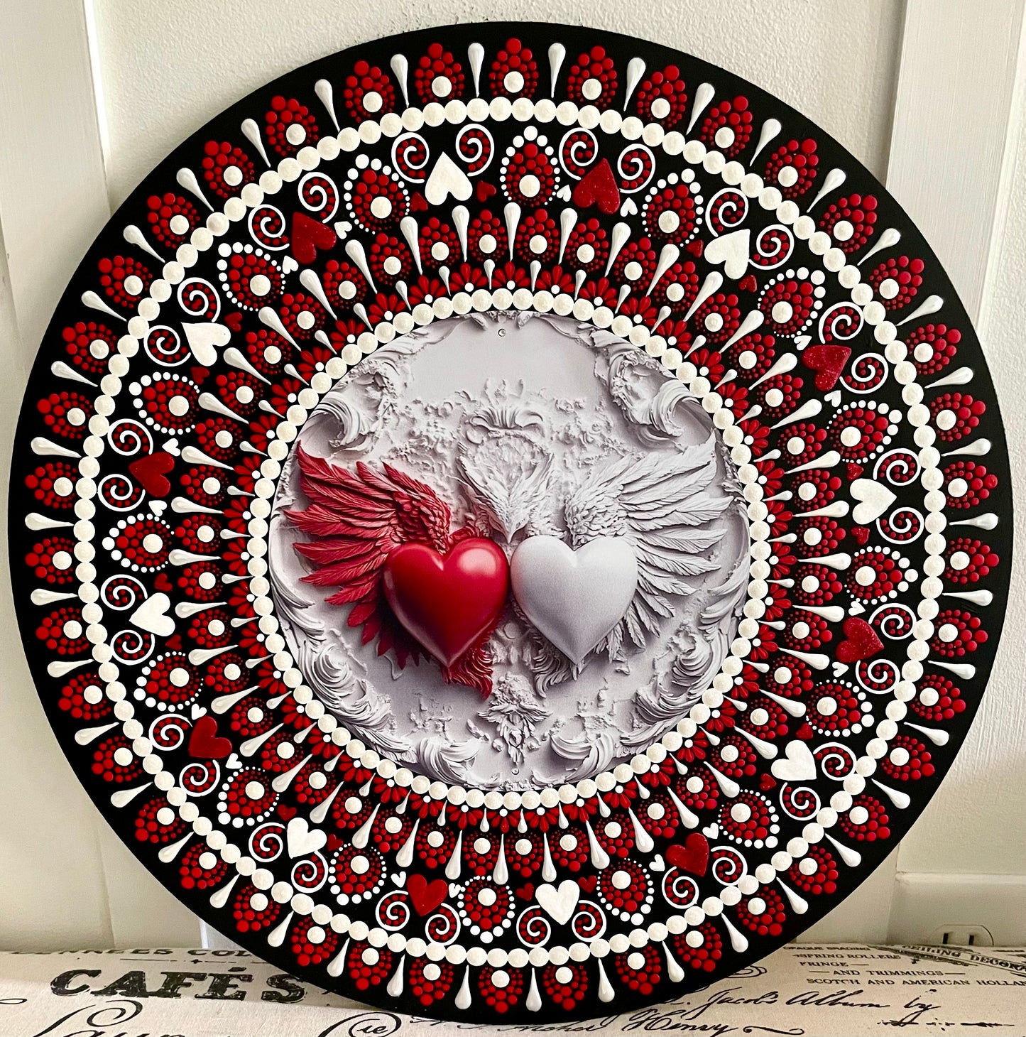 Red and white heart plaque on a 16 inch wood round