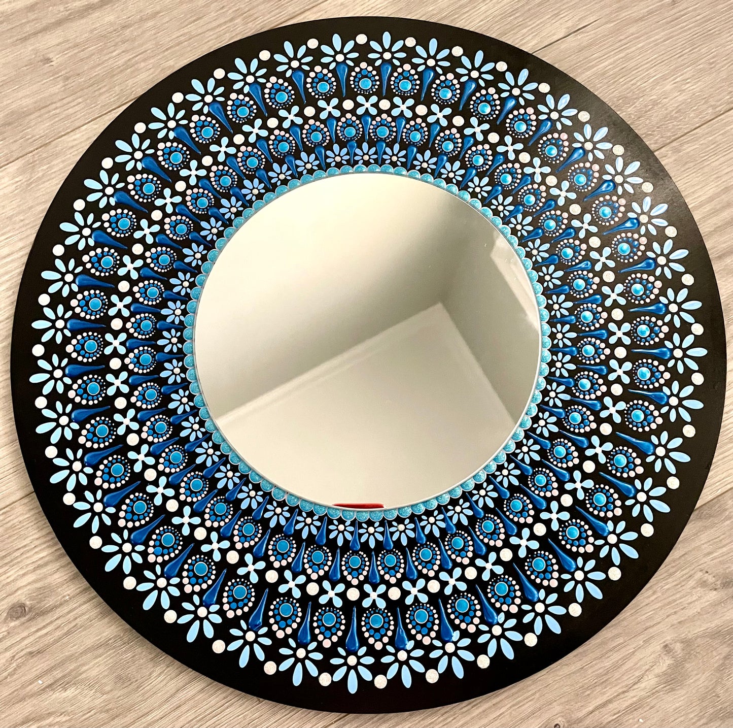 Hand painted blue mirror on a 16 inch wood round ￼