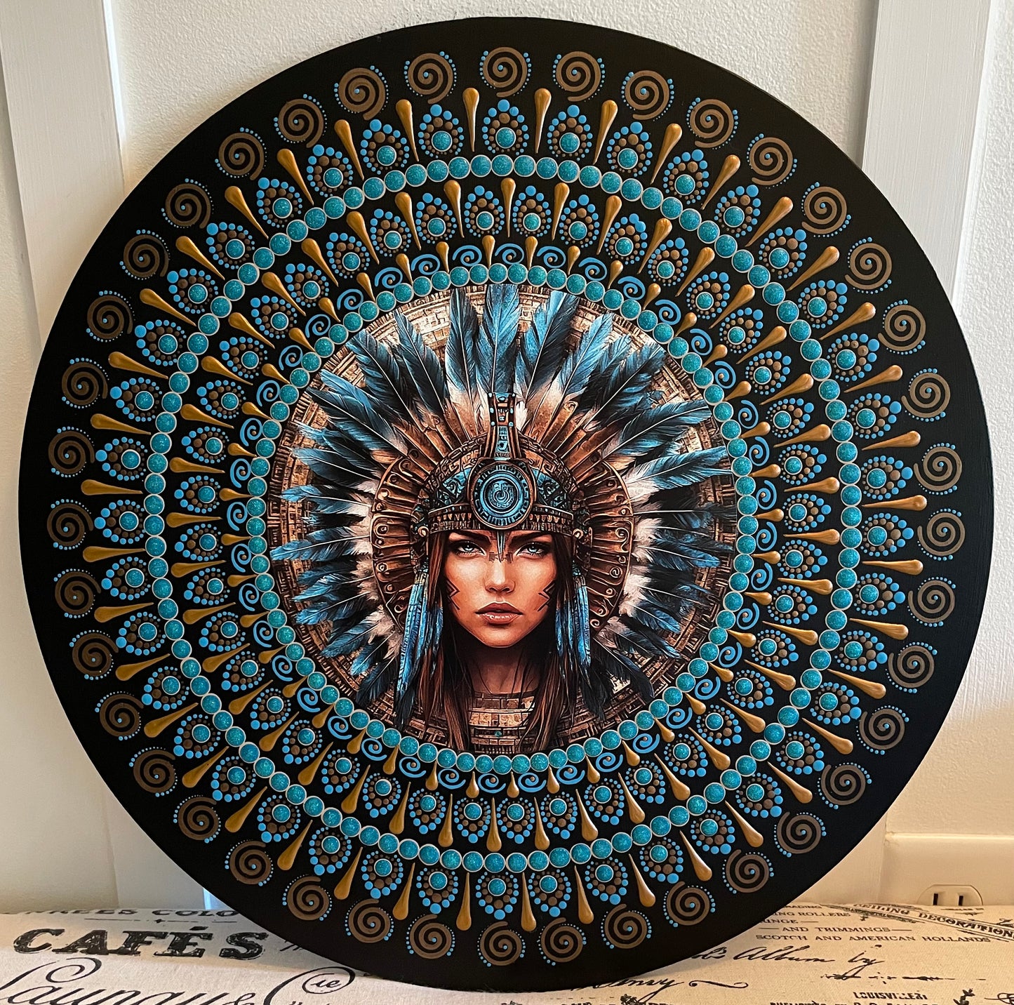 Handpainted feather plaque on a 16 inch wood round