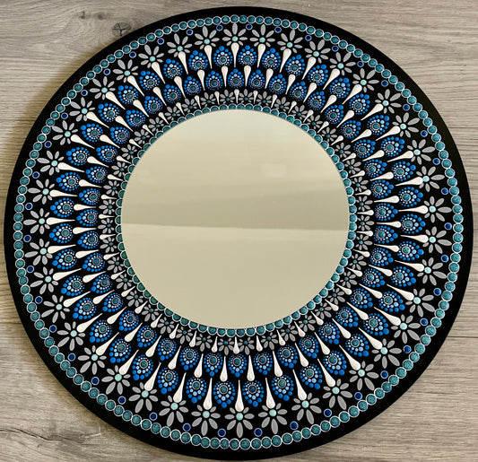 Hand painted 16 inch wood round with mirror in the center. ￼