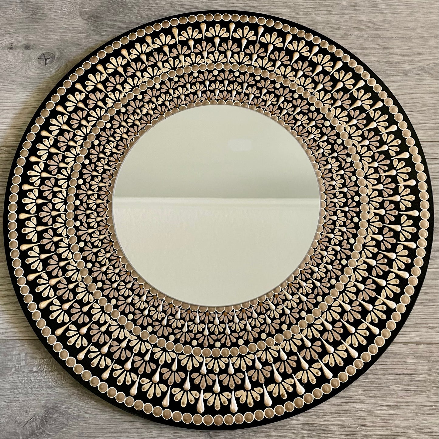 Hand painted 16 inch wood round with an 8 inch mirror in the center ￼