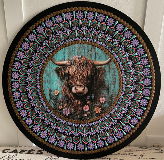 Handpainted Highland cow design on a 16 inch wood round