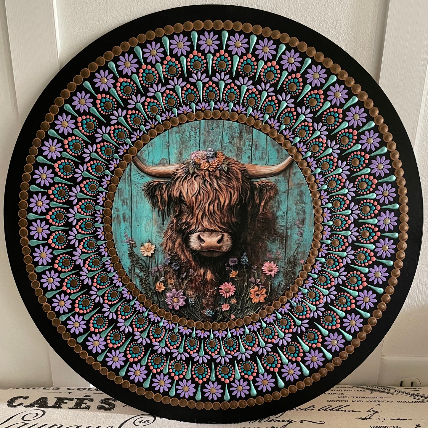 Handpainted Highland cow design on a 16 inch wood round