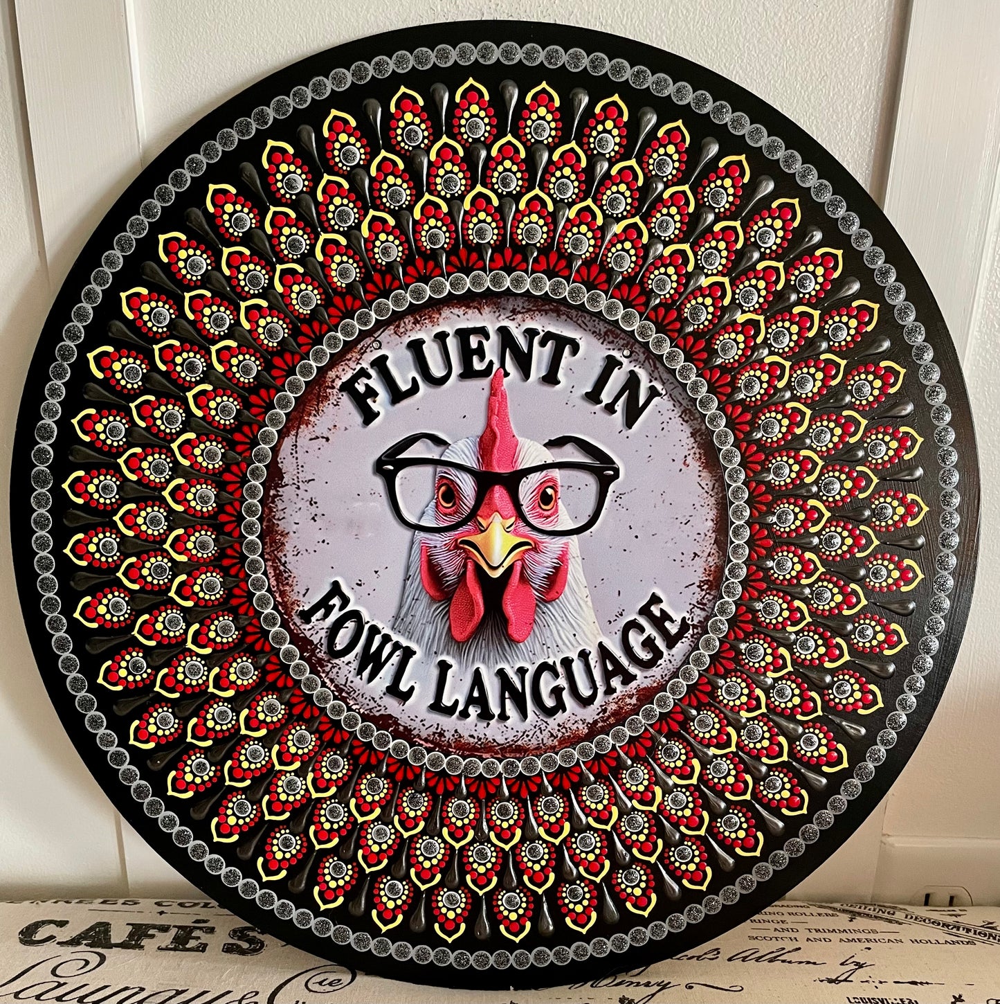 Hand painted chicken plaque on a 16 inch wood round. ￼